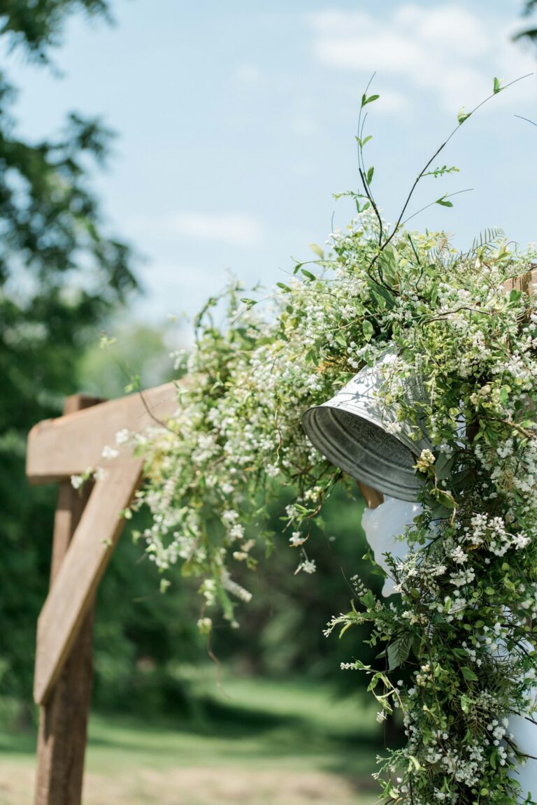 Floral ceremony arch set in an olive grove