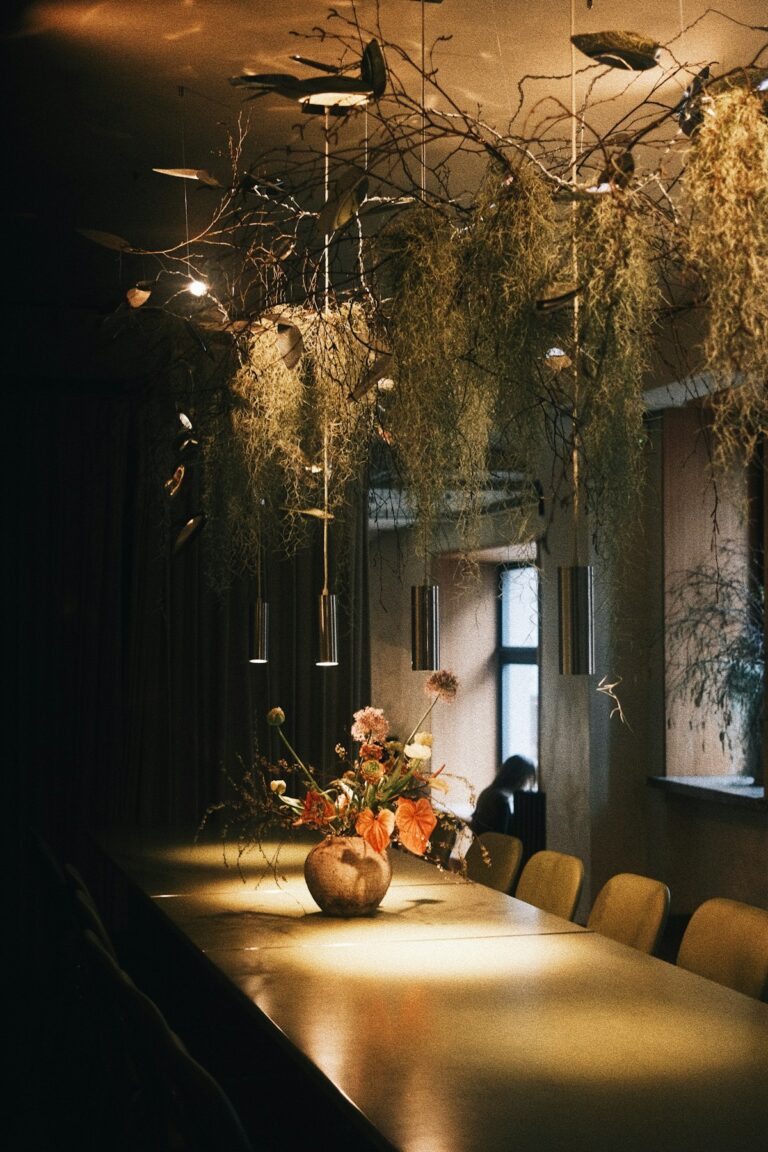 Suspended floral installation above a table in a restaurant
